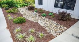 Mulching-min Bloomington Mulching Services at a house provided by Wells Lawn Care & Landscaping