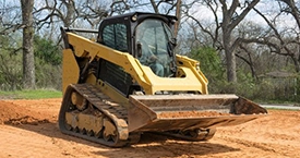 downspouts Bloomington Mulching Services at a house provided by Wells Lawn Care & Landscaping